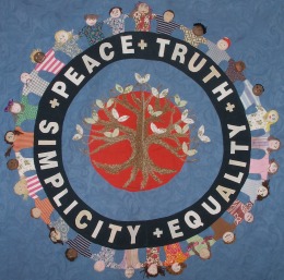 An embroidered quilt with the Quaker testimony: peace, truth, simplicity, equality